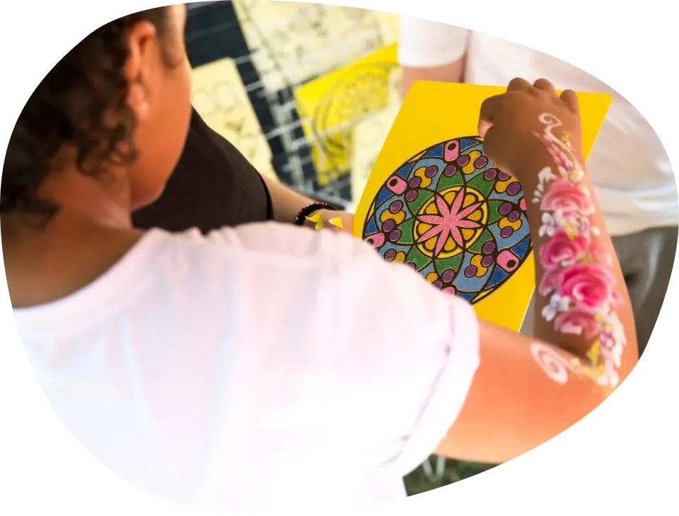 A child taking part in a craft activity at Battersea Community Festival