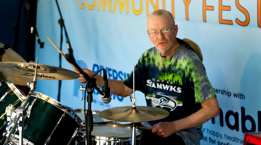A man playing the drums on the stage