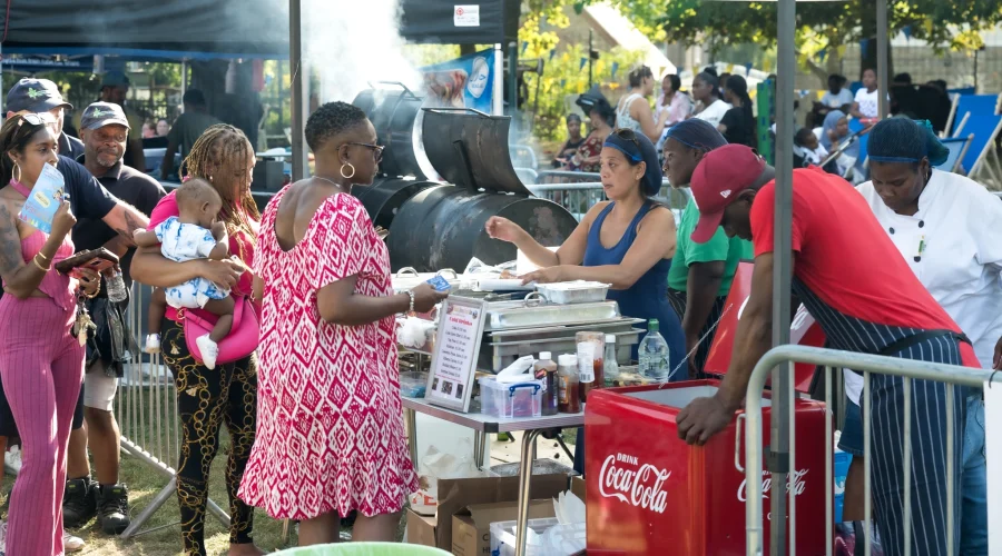 Some people buying food at a stall